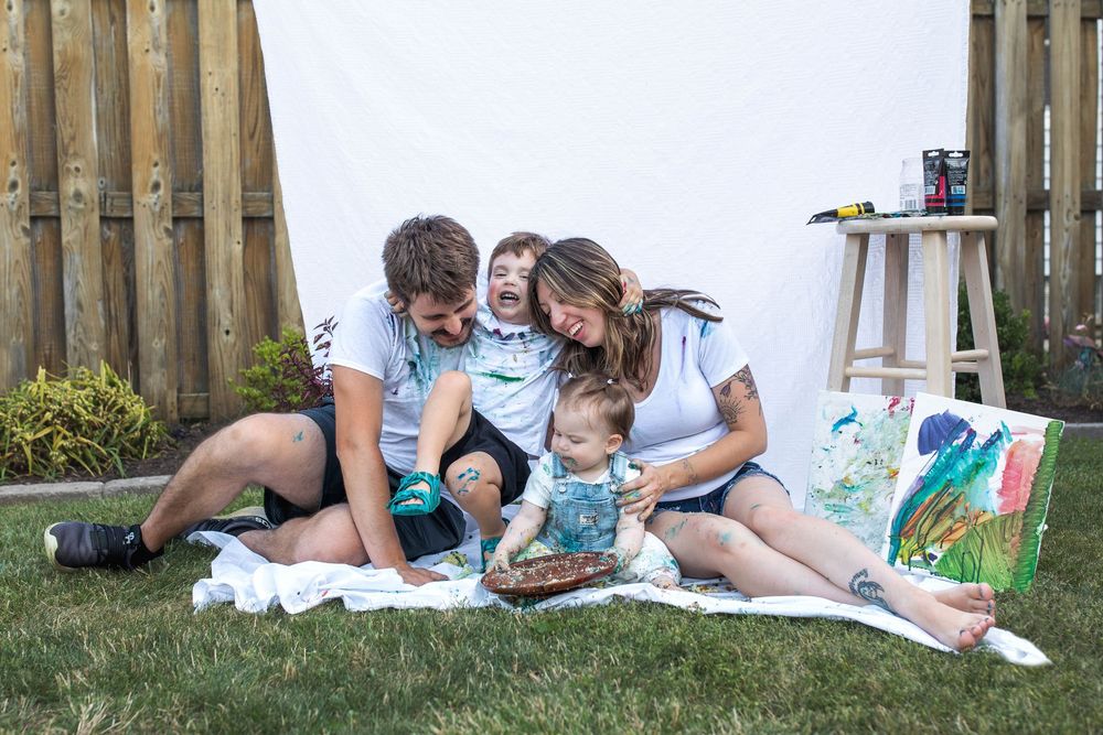 Glo Photo and Design captures paint inspired milestone smash cake session with young family
