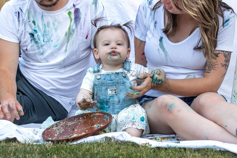 Glo Photo and Design captures paint inspired milestone smash cake session with young family