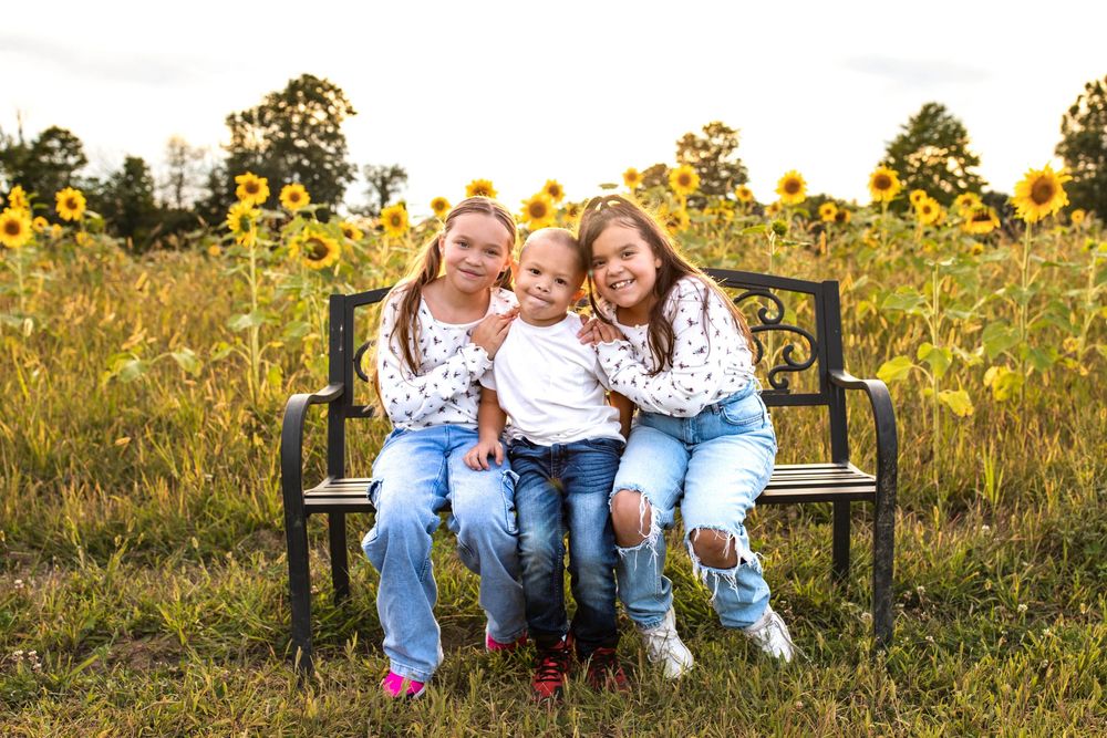 Glo Photo and Design captures sunset family photography session at Medina Sunflower fields