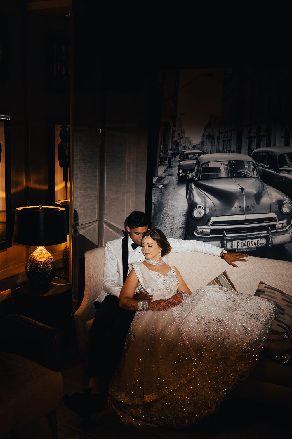 A sequence of moody boudoir photos featuring a flowing white dress against dark vintage-style backgrounds.