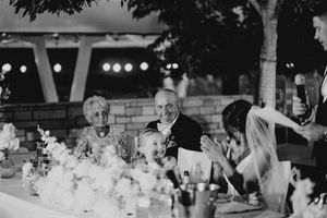 A black and white collage of wedding reception scenes showing decorated tables, dancing guests, and festive celebrations.