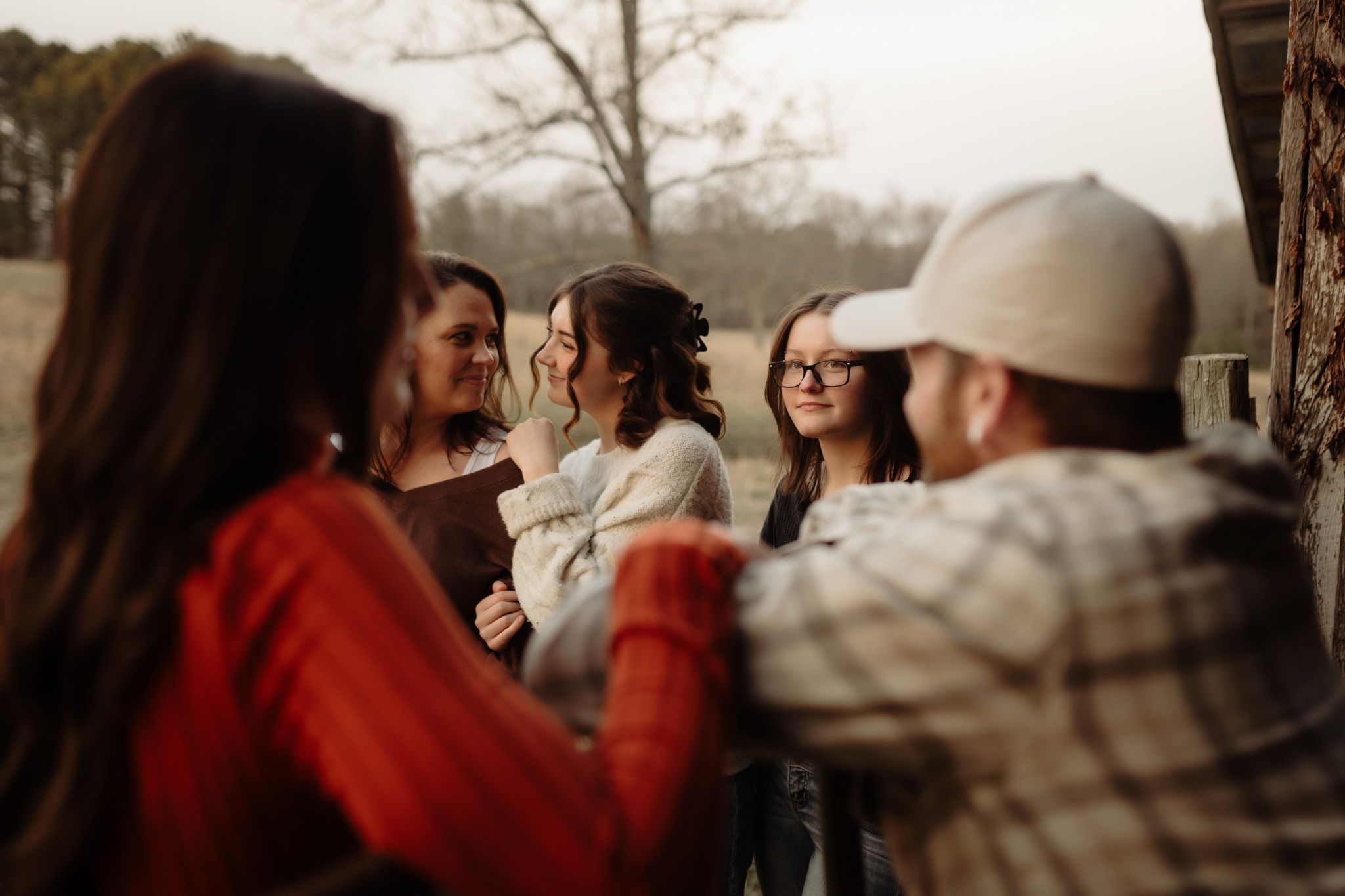 A series of candid moments captured during an outdoor gathering with people in casual attire.