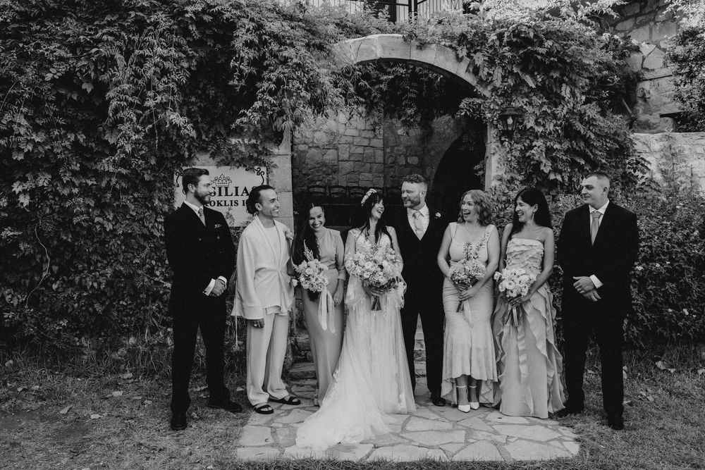 A collection of black and white wedding photos arranged in a horizontal strip showing outdoor ceremony moments.