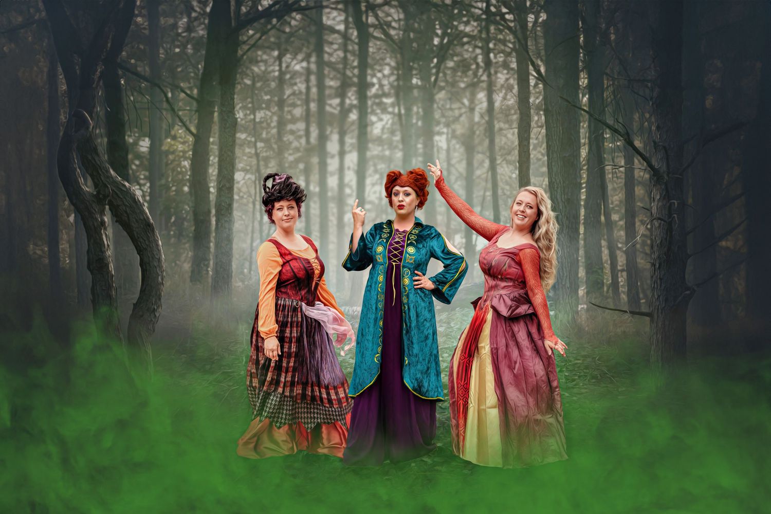 Whimsical forest scene with people in colorful costumes among misty trees.