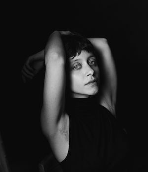 Dramatic black and white portrait series showing different angles of a person's face in shadow against dark backgrounds.