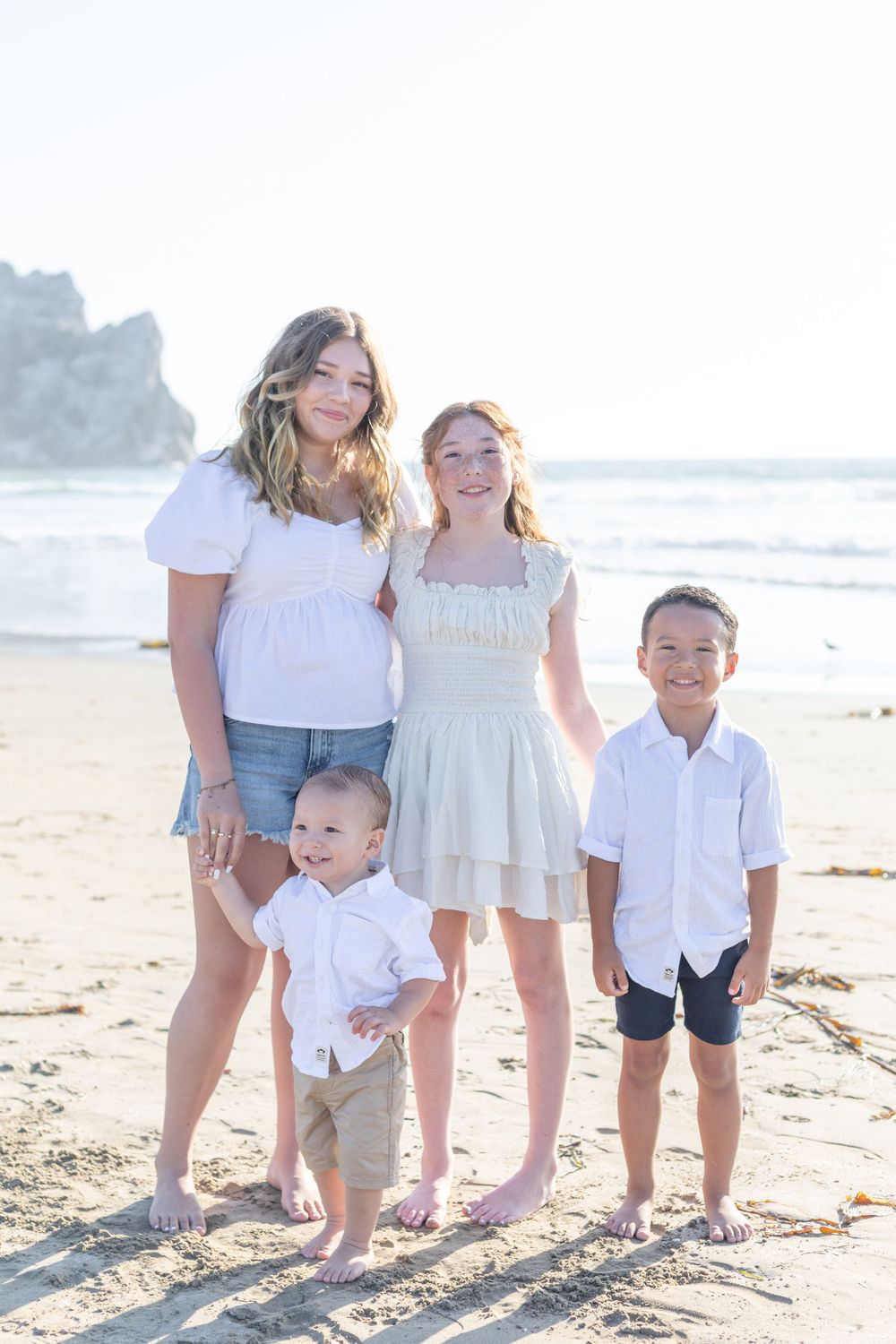 Heartwarming scene of a family, such as parents and children, smiling and laughing together, captured in a natural light setting with a clea