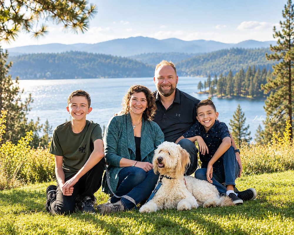 Family of four with a doodle dog portrait by Coeur d Alene lake photographer Luba Wold in Post Falls Idaho