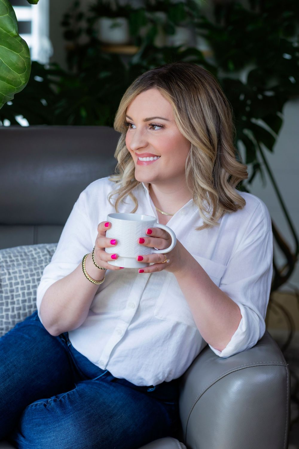 A sequence of relaxed lifestyle photos showing someone in a white shirt enjoying coffee on a gray couch.