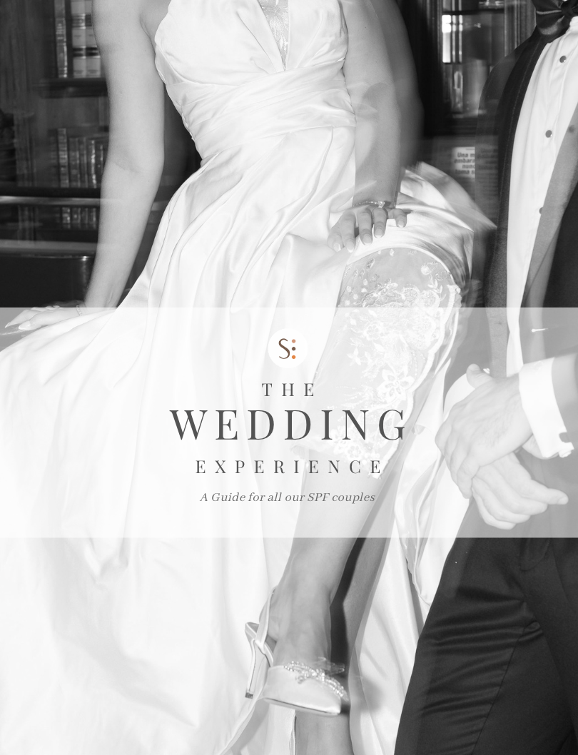 Black and white wedding guide cover featuring a bride in a strapless gown and groom in a tuxedo holding champagne.