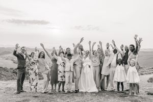 A series of black and white wedding party photos showing joyful celebrations at different outdoor locations.