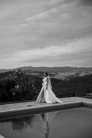 A dramatic black and white panoramic sequence shows a bride in a flowing veil against a scenic mountain landscape.