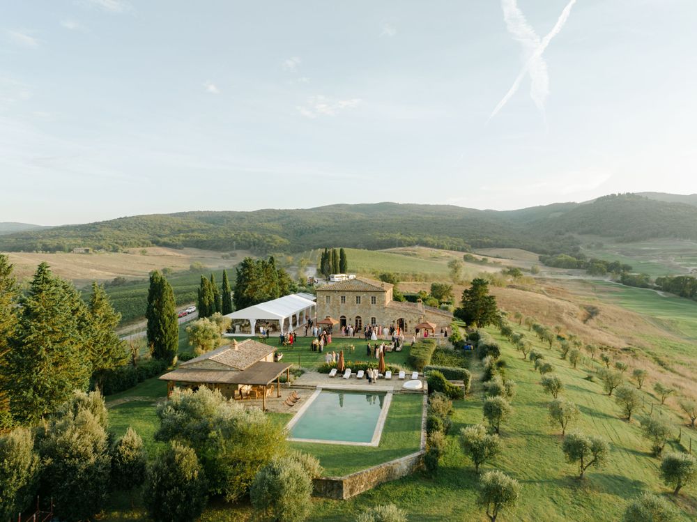 Stunning aerial view of Castiglion del Bosco's luxury villa during a reception party