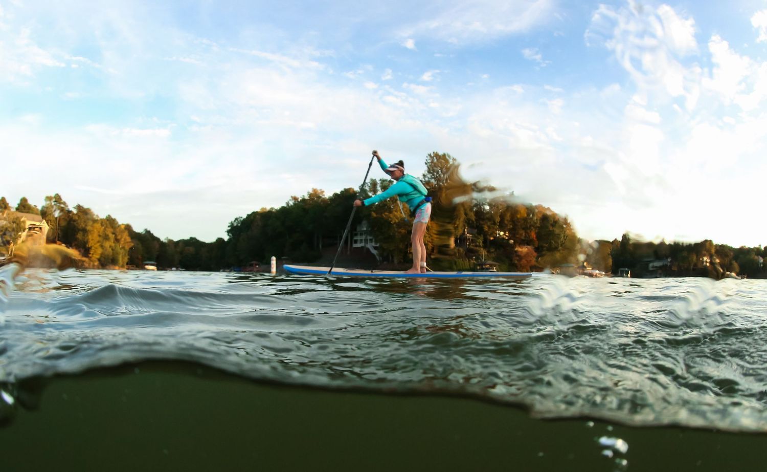 Split image underwater action shot of paddleboarder on Lake Wylie out with the Goat Boaters.