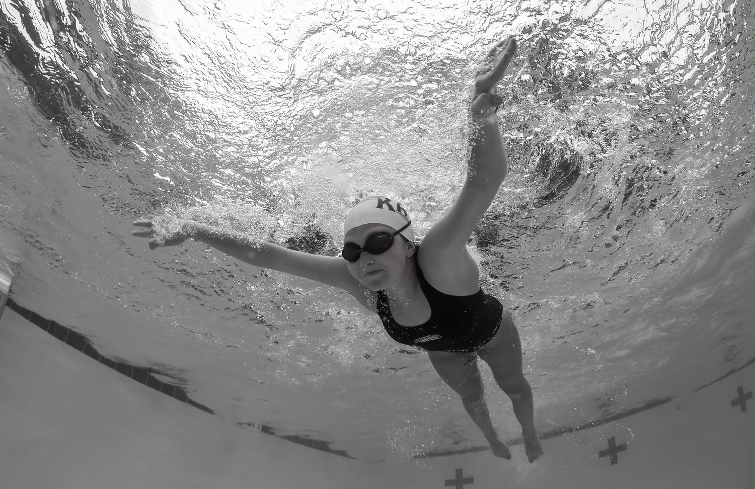 Black and white underwater image of swimmer swimming butterfly. Canon and Ikelite housing used.