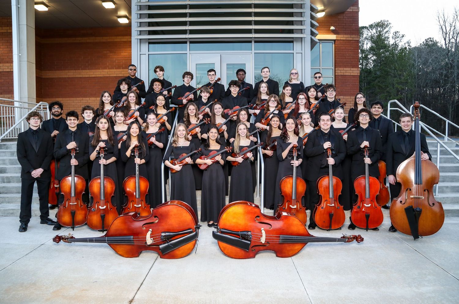 Harrison High School String Orchestra posed outside the Preforming Arts Building in their concert attire. Band, Senior Pictures