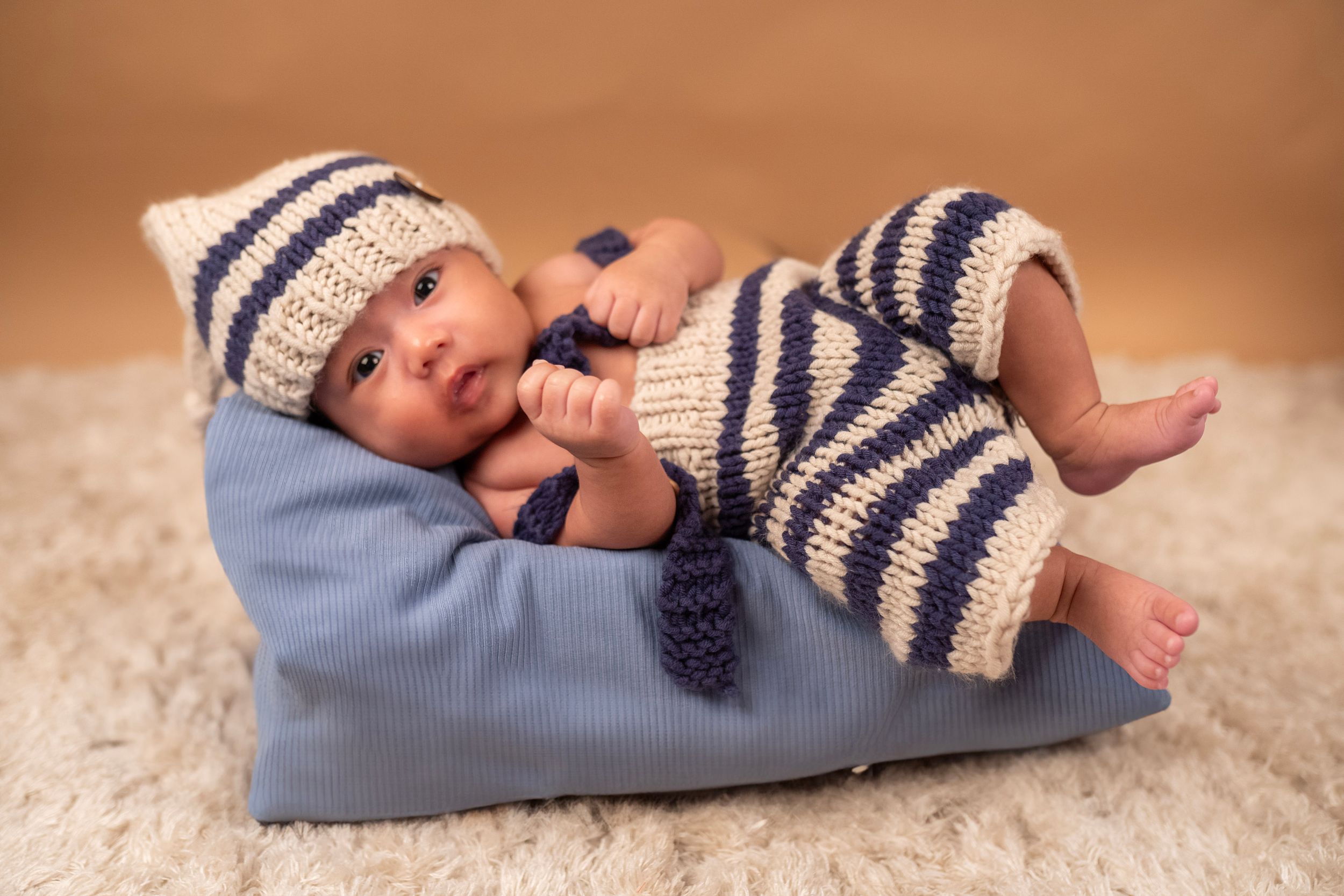 baby laying on pillow