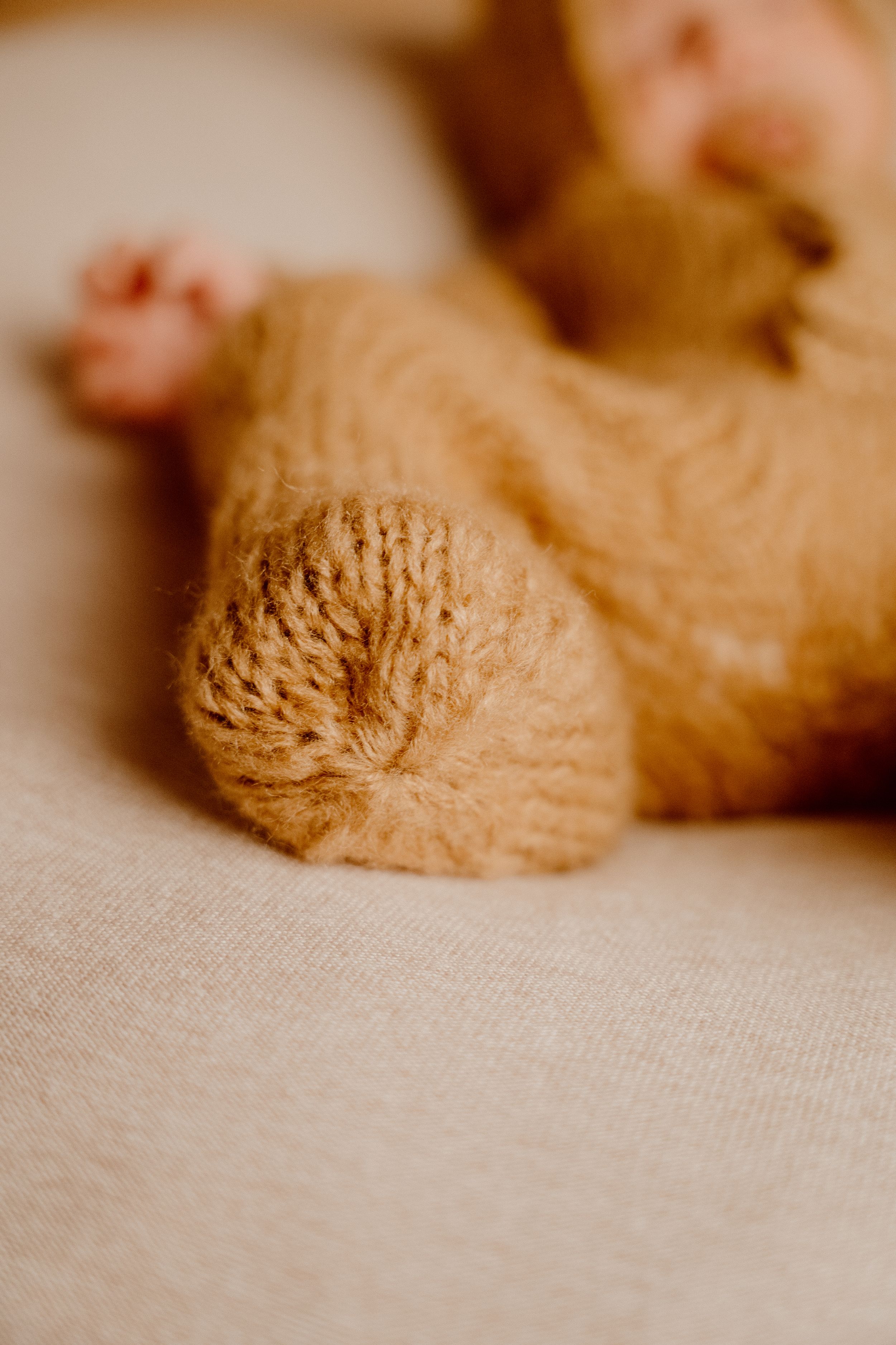 foot of baby in bear costume
