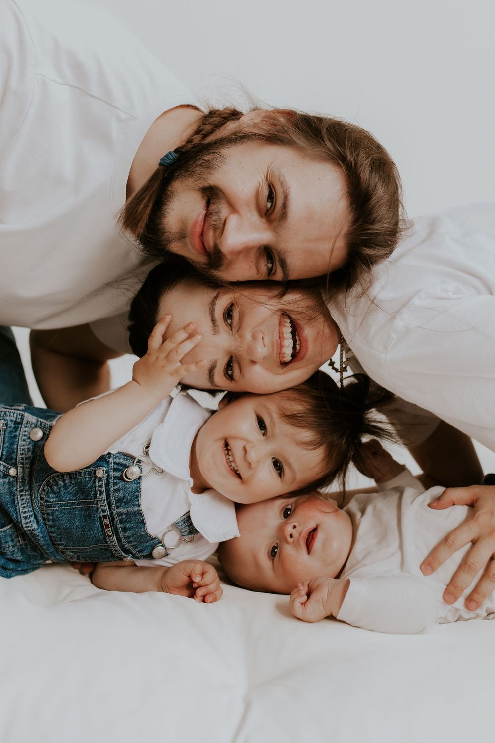Candid black and white portrait showing laughter and joy between family members.