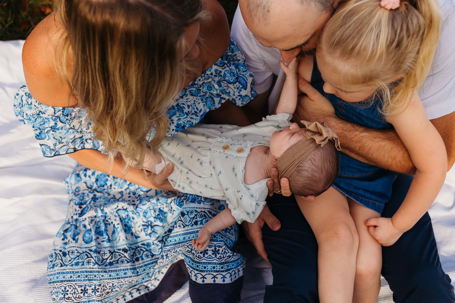 at home family newborn session in backyard with sister and parents serving ottawa valley