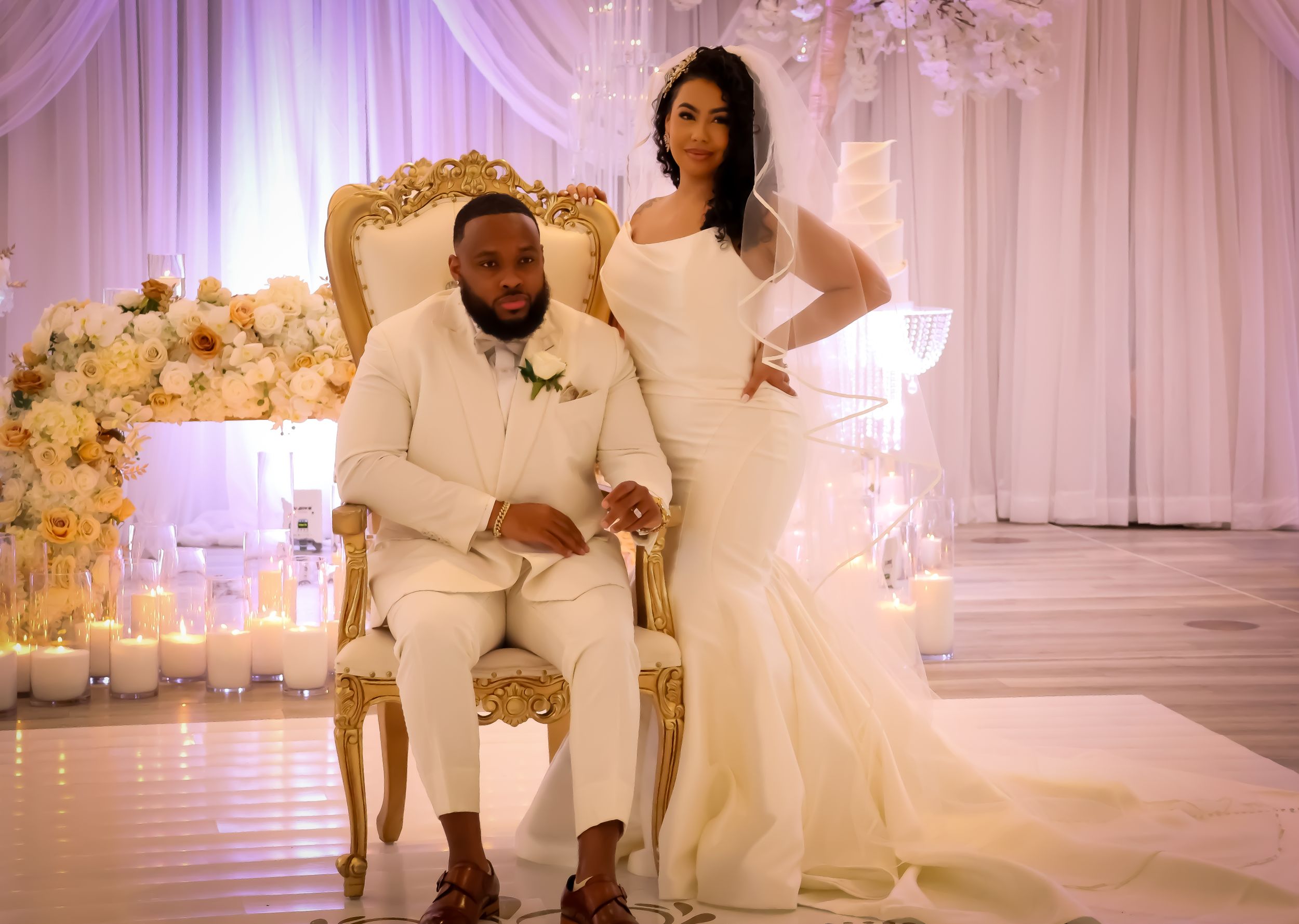 Elegant all-white wedding reception setup with luxurious decor and lighting.