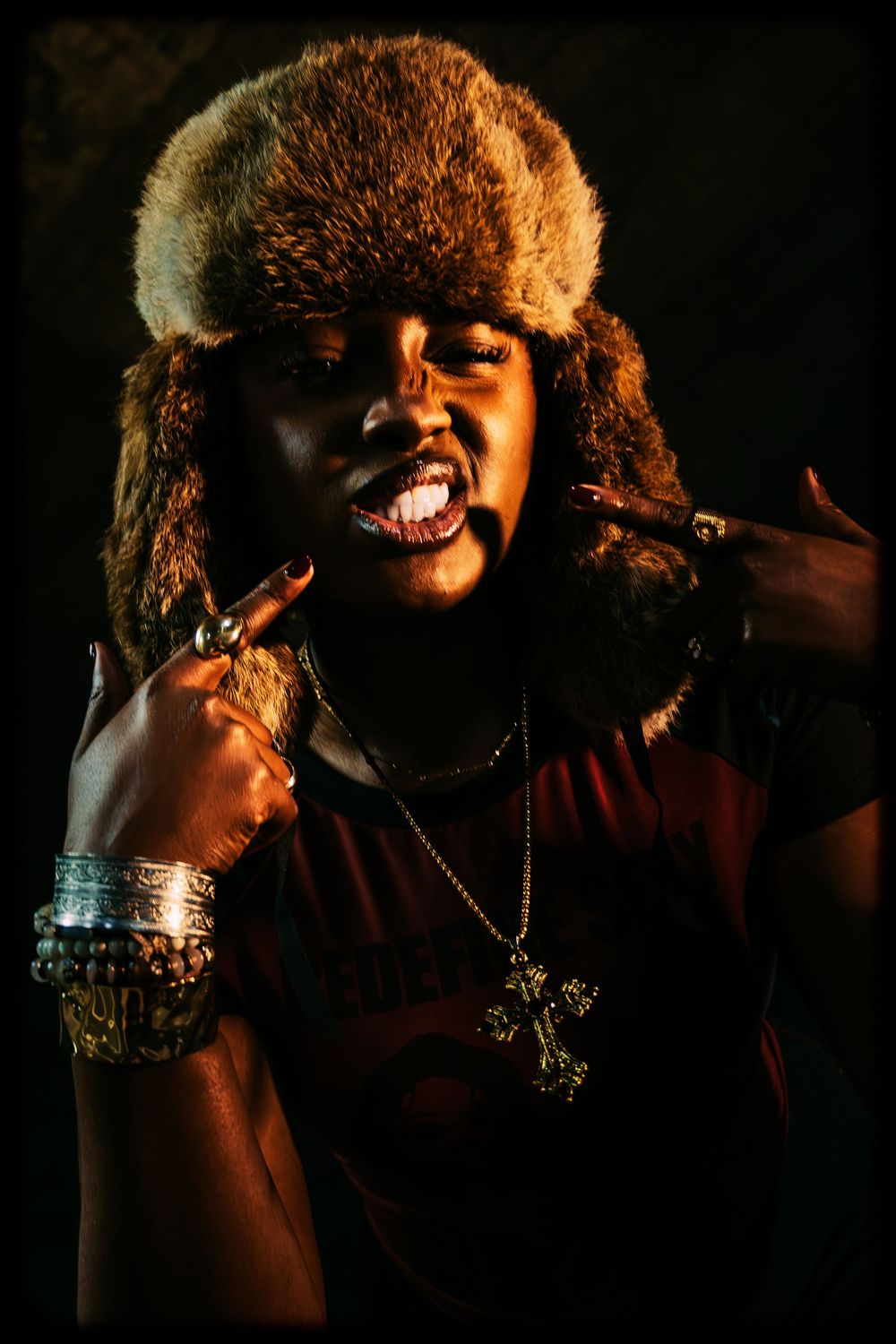 Dark atmospheric performance photos show a singer with curly hair and dramatic lighting on stage during a show.