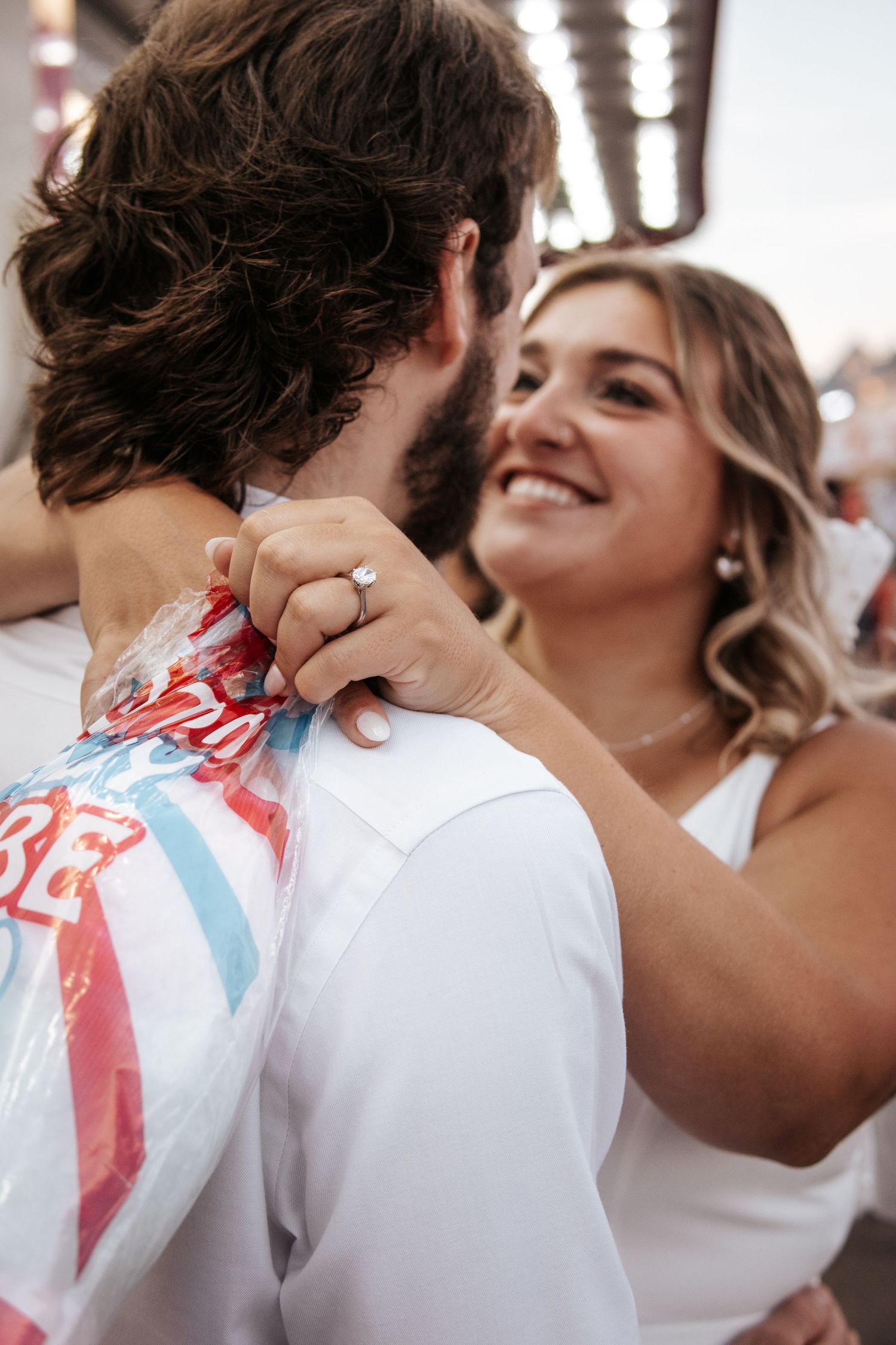A candid dancing moment at a wedding showing an engagement ring and joyful embrace. Photo at Charlottetown PEI Old Home Week