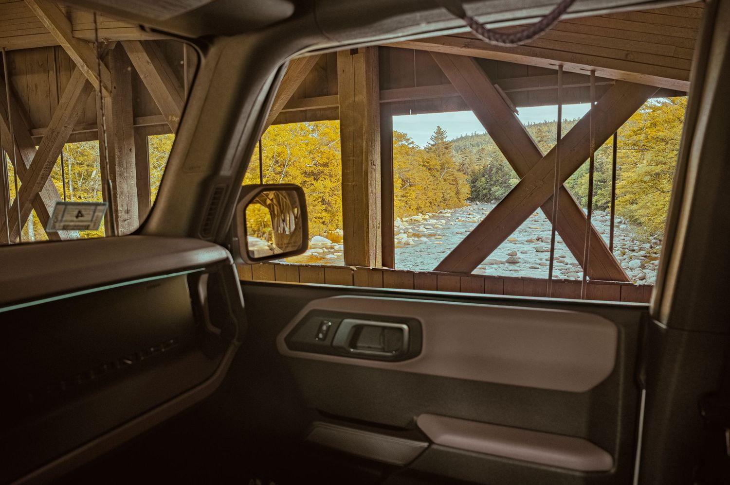 Vintage wooden station wagon interior with brown vinyl seats and wood paneling visible through multiple angles.