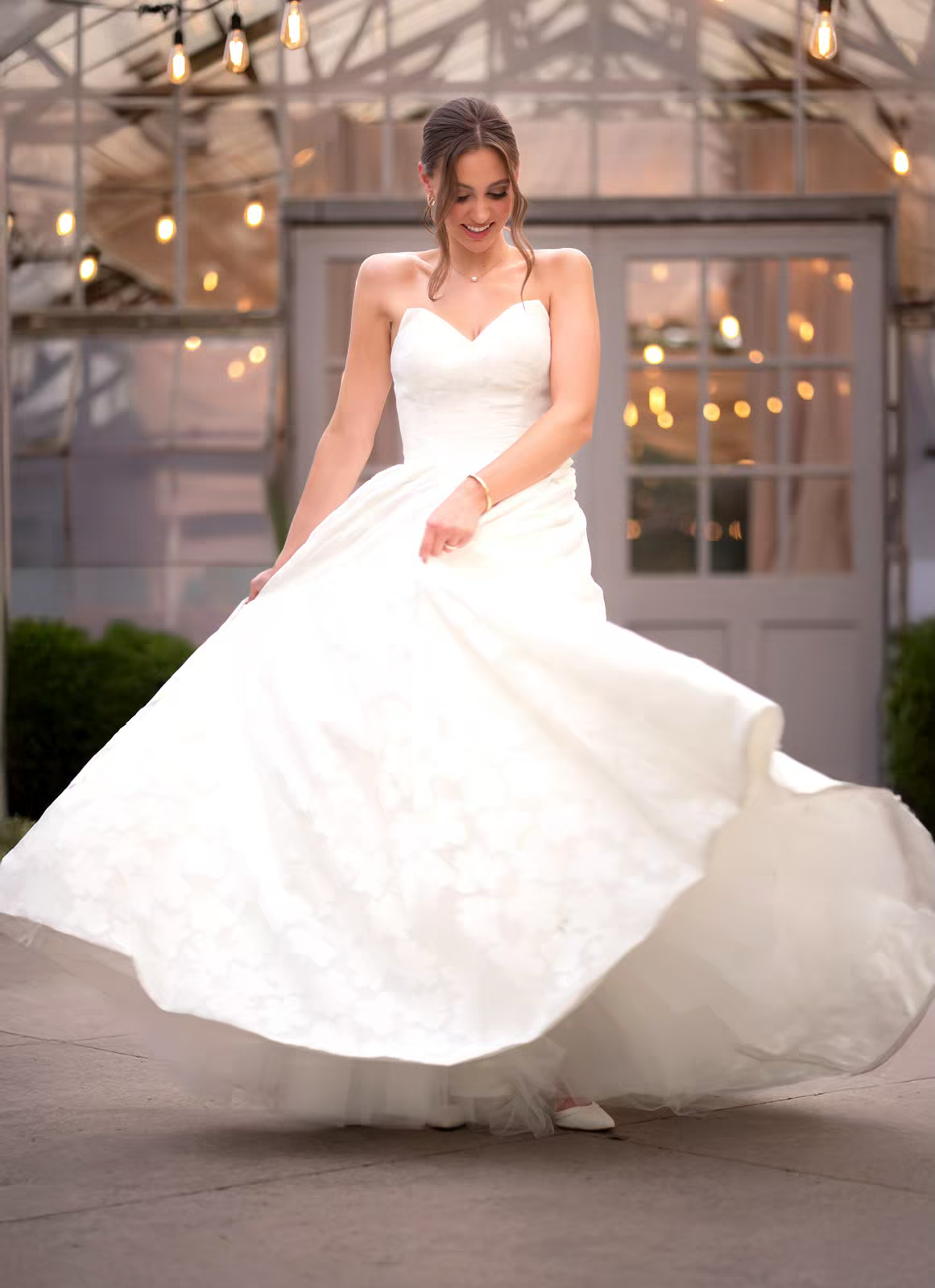Bride twirling in flowing white wedding dress in Columbus Ohio wedding