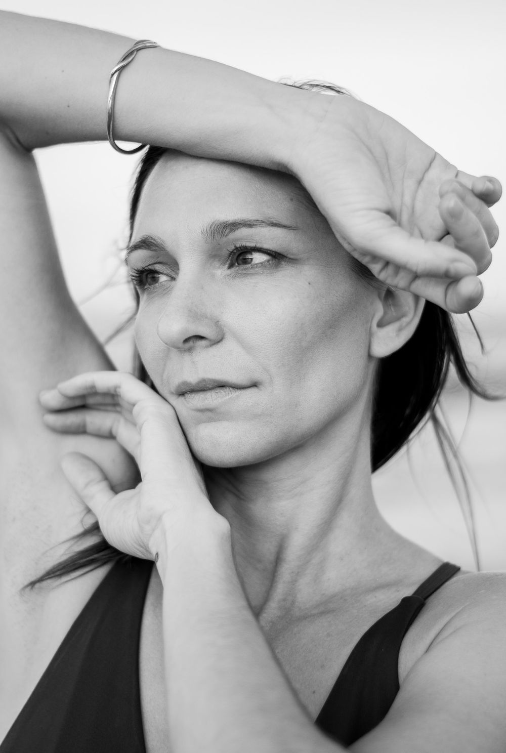 Women holding her arms to her face during a portrait photoshoot in Playa Negra Costa Rica