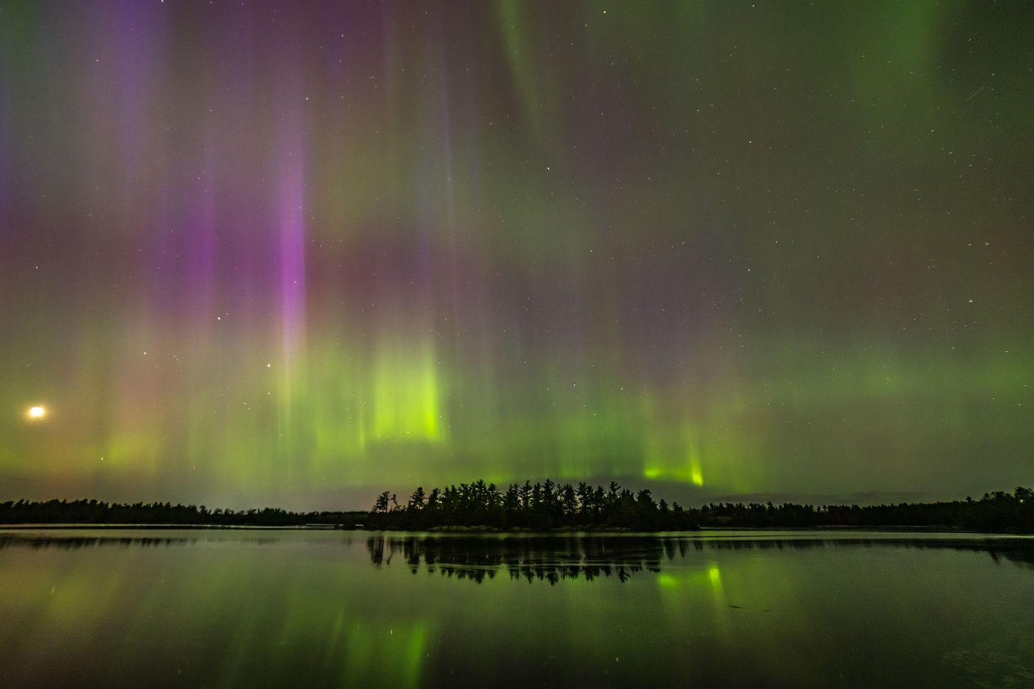 Northern Lights over a reservoir island May 2024
