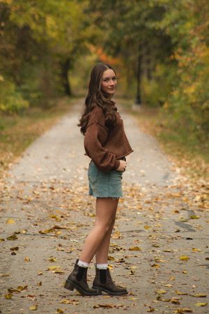 a girl posing in a walkway