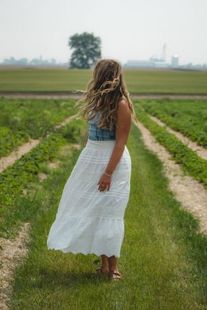 a girl standing in the wind