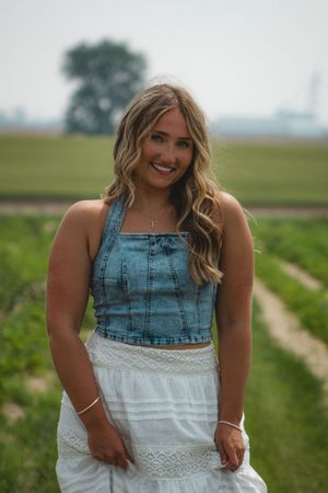 a girl holding her flowy skirt