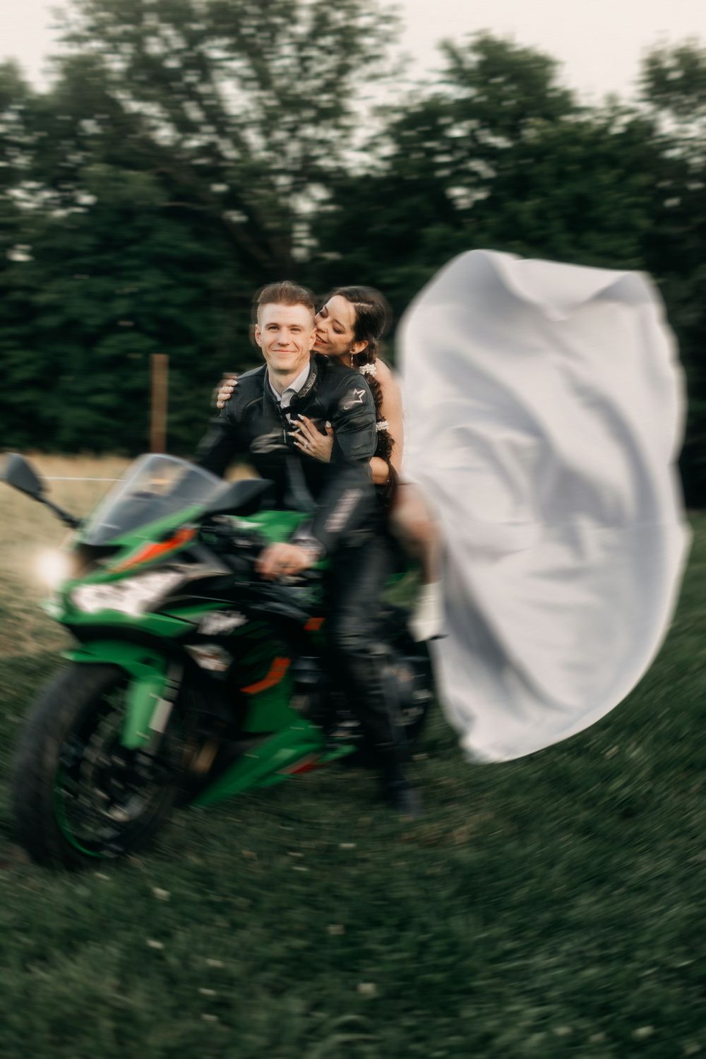 Dynamic motion sequence of wedding couple on motorcycles in outdoor setting.