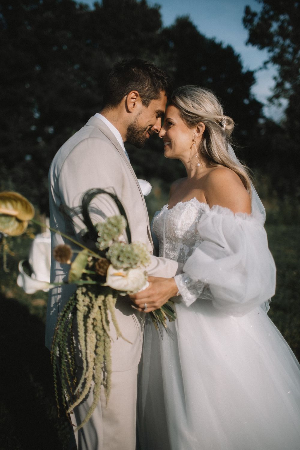 A tender wedding moment photographed in fading evening light.