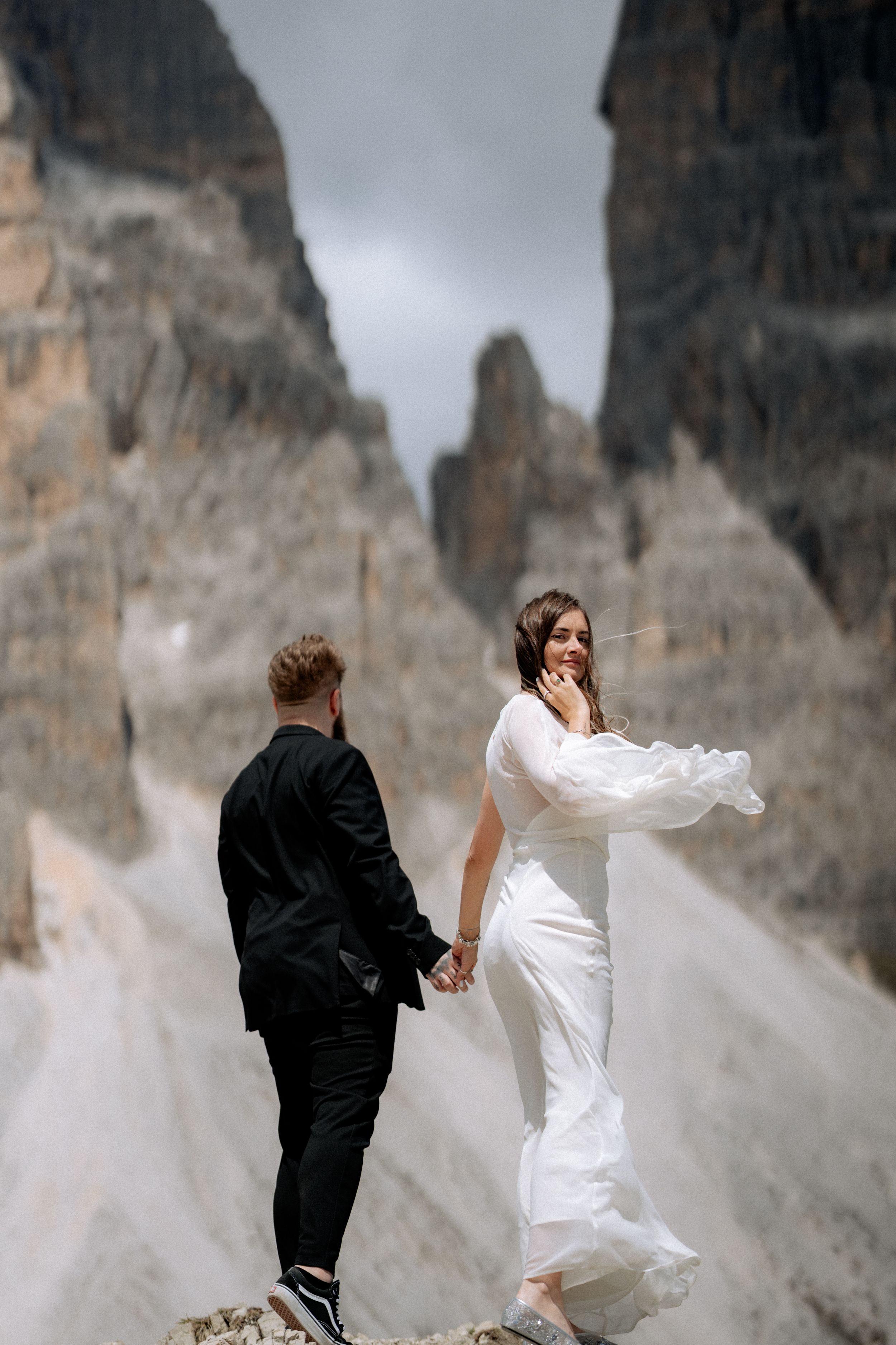 Romantic portrait of the newlyweds against a stunning sunset backdrop.