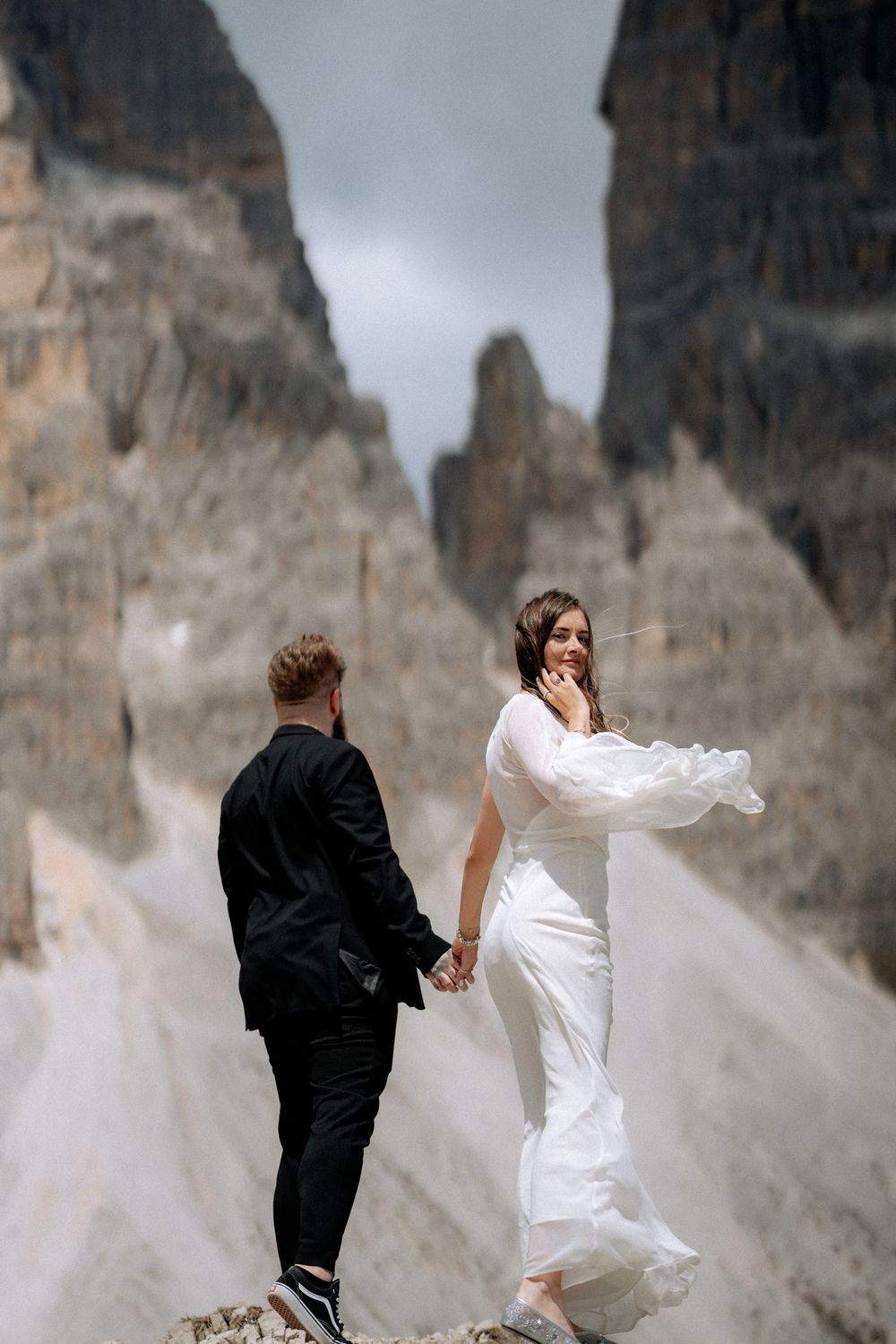 Romantic portrait of the newlyweds against a stunning sunset backdrop.