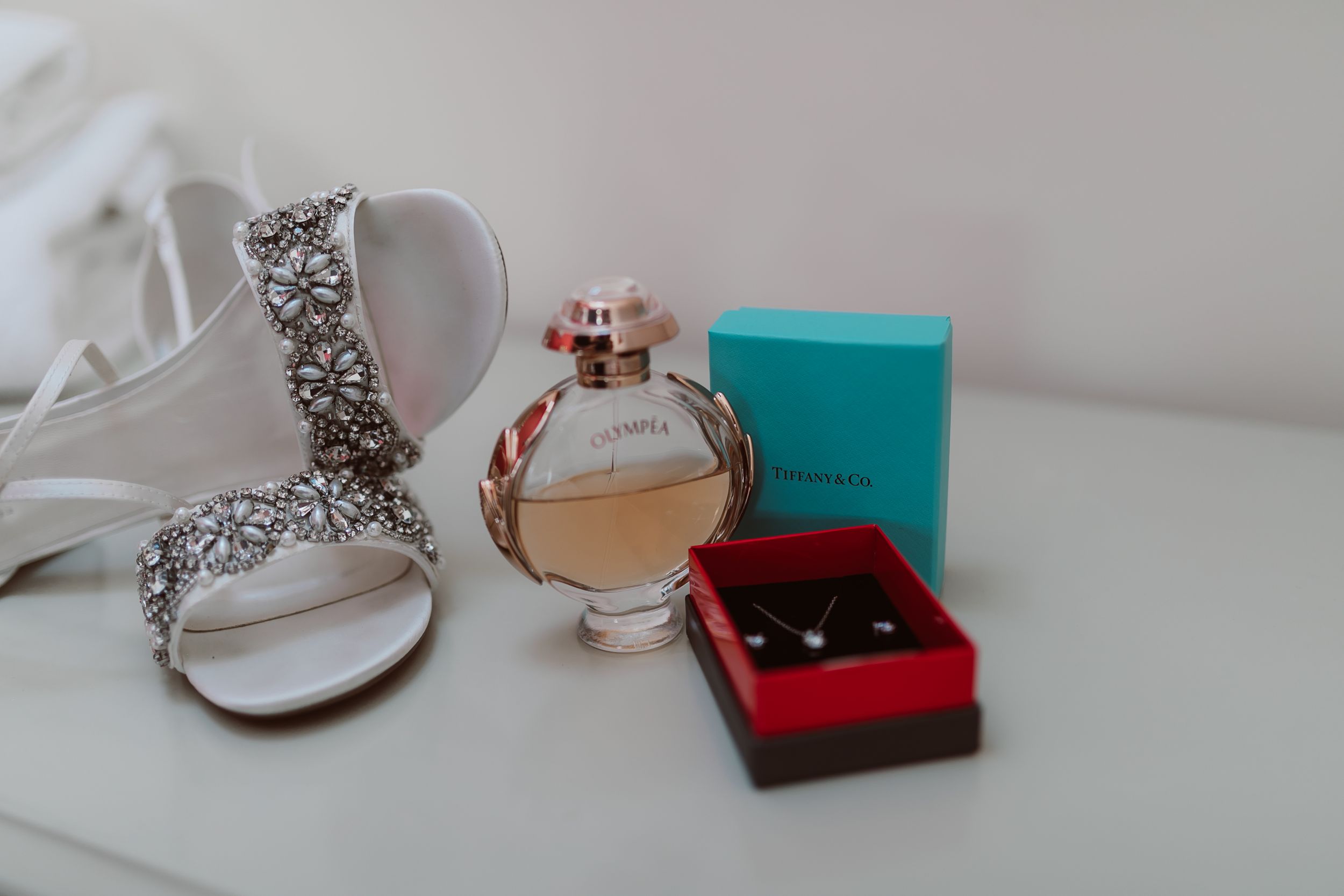 Close-up of elegant silver jewellery and accessories on white surface. Photographer. Hull. East Yorkshire. Photography