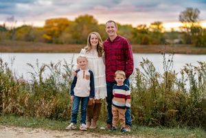 A collection of outdoor family portraits taken at sunset in a natural field setting with tall grass and warm autumn colors.