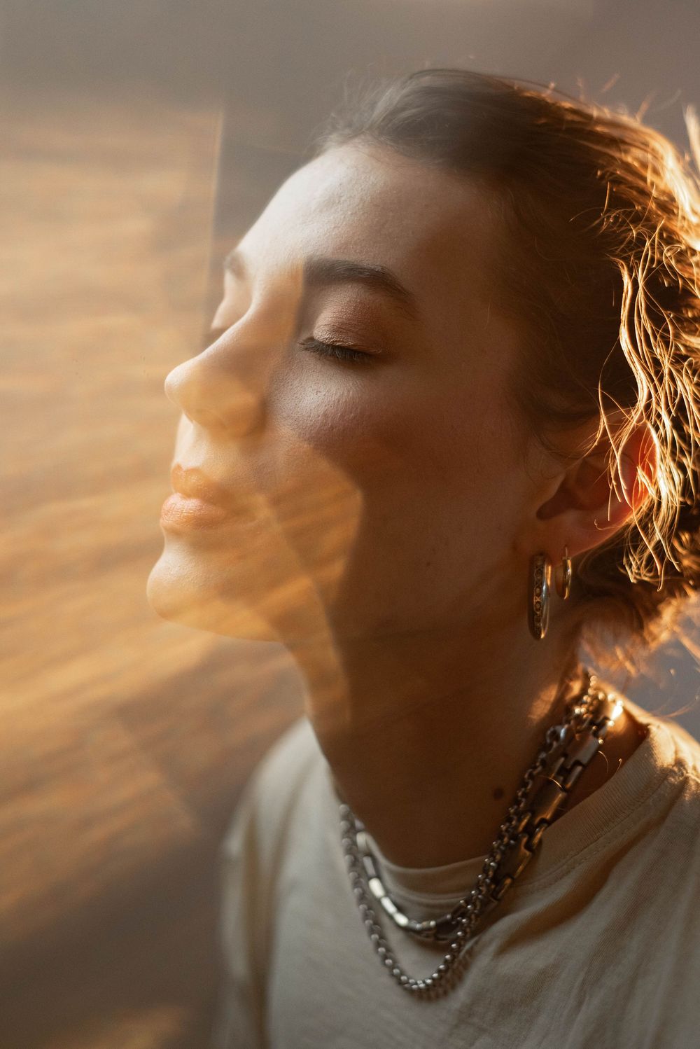 Golden hour portrait sequence with dramatic backlighting and jewelry details.
