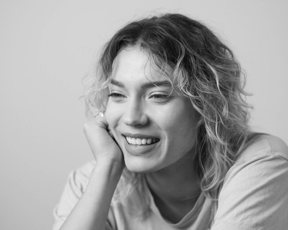 Candid portrait sequence capturing natural smiles and relaxed poses.