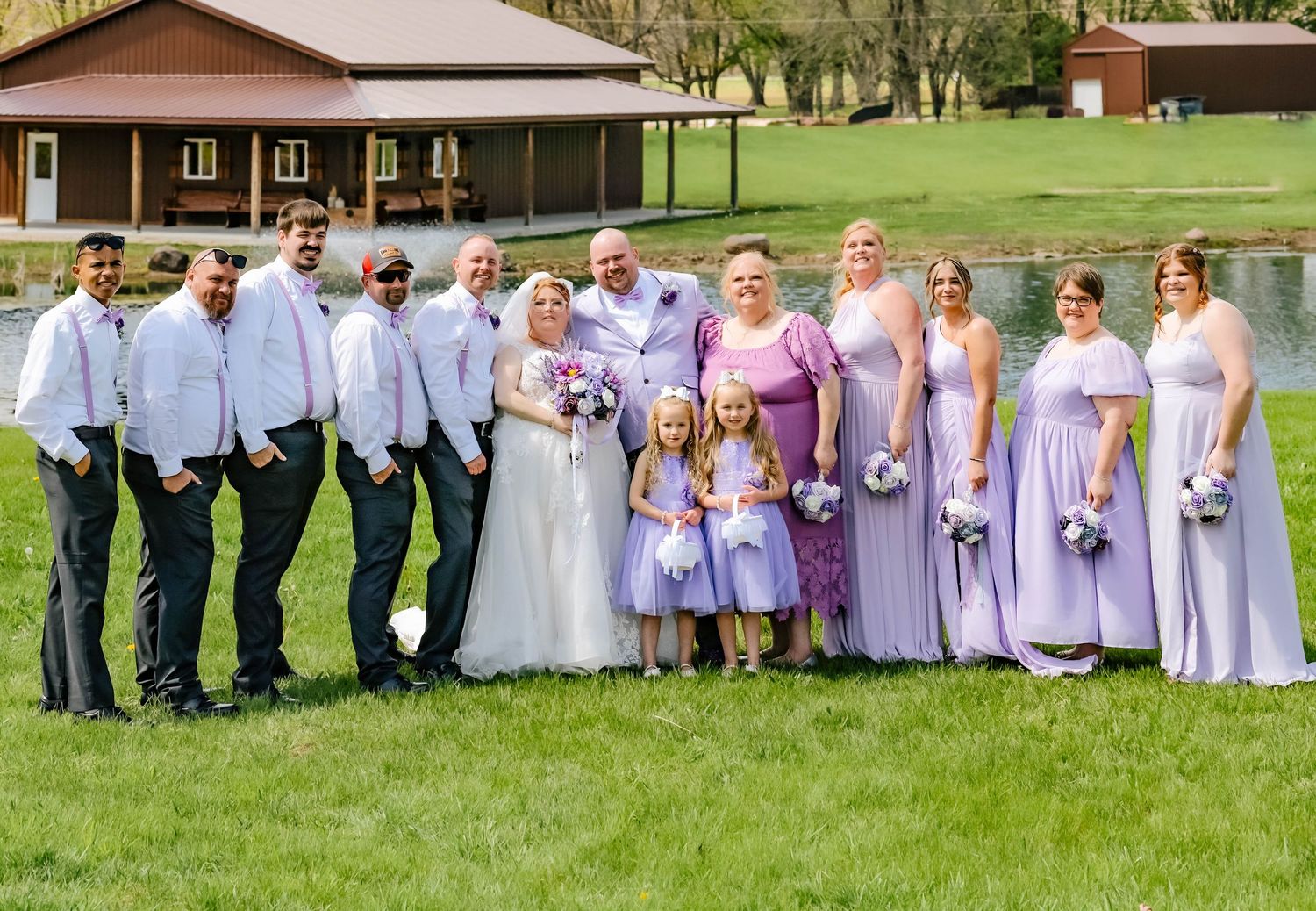 Two football fans sharing a moment outdoors, one wearing a black #3 Haley jersey and another holding a football.