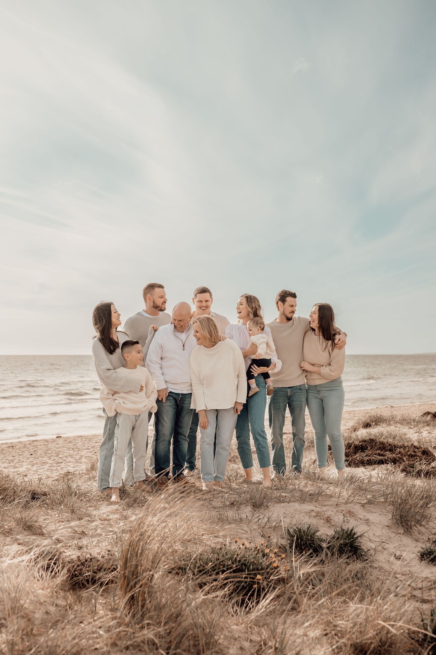 Light & airy beach family photography capturing love across generations. Candid, joyful moments in nature. Book your session today!