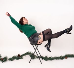Dynamic photo sequence of person in green sweater falling backwards from chair.