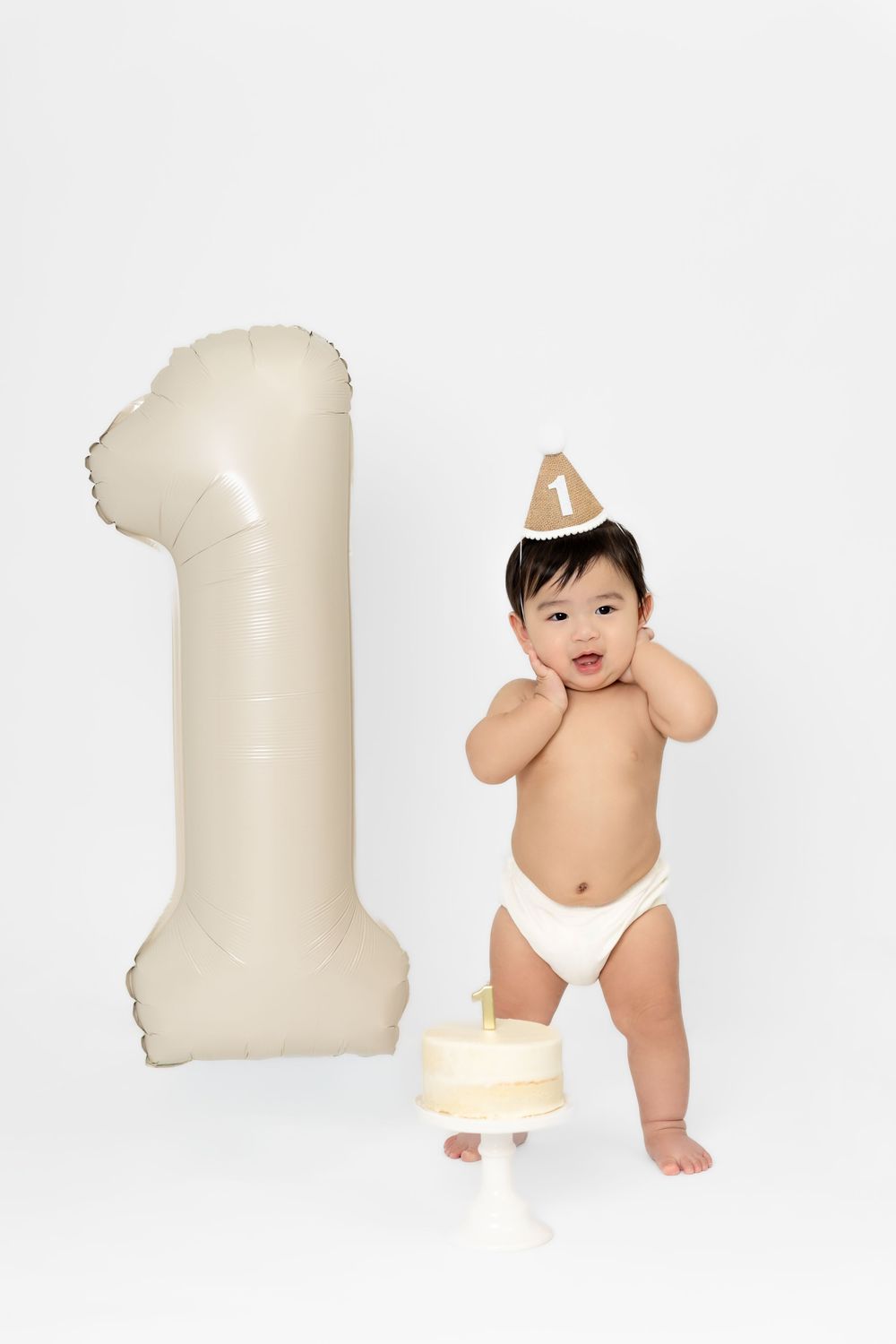 A series of four sequential images showing a baby in a diaper playing and moving next to a white pillow.