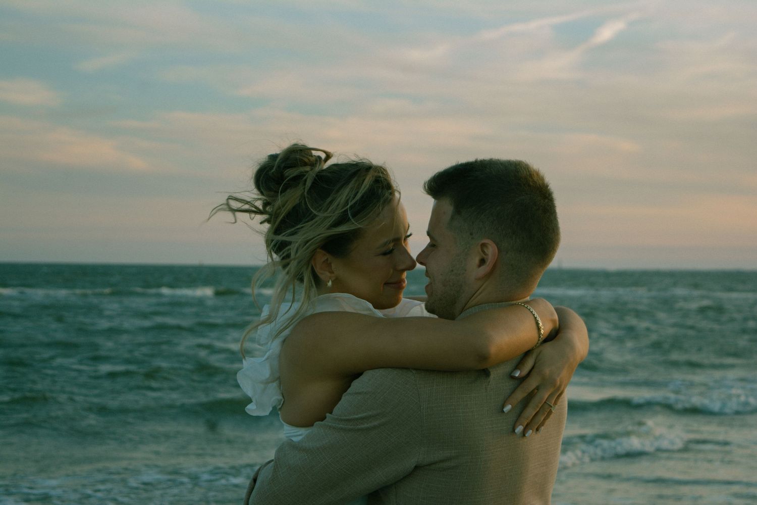 Intimate close-up of a couple during their engagement session in Charleston, SC, capturing a tender moment of love and connection.