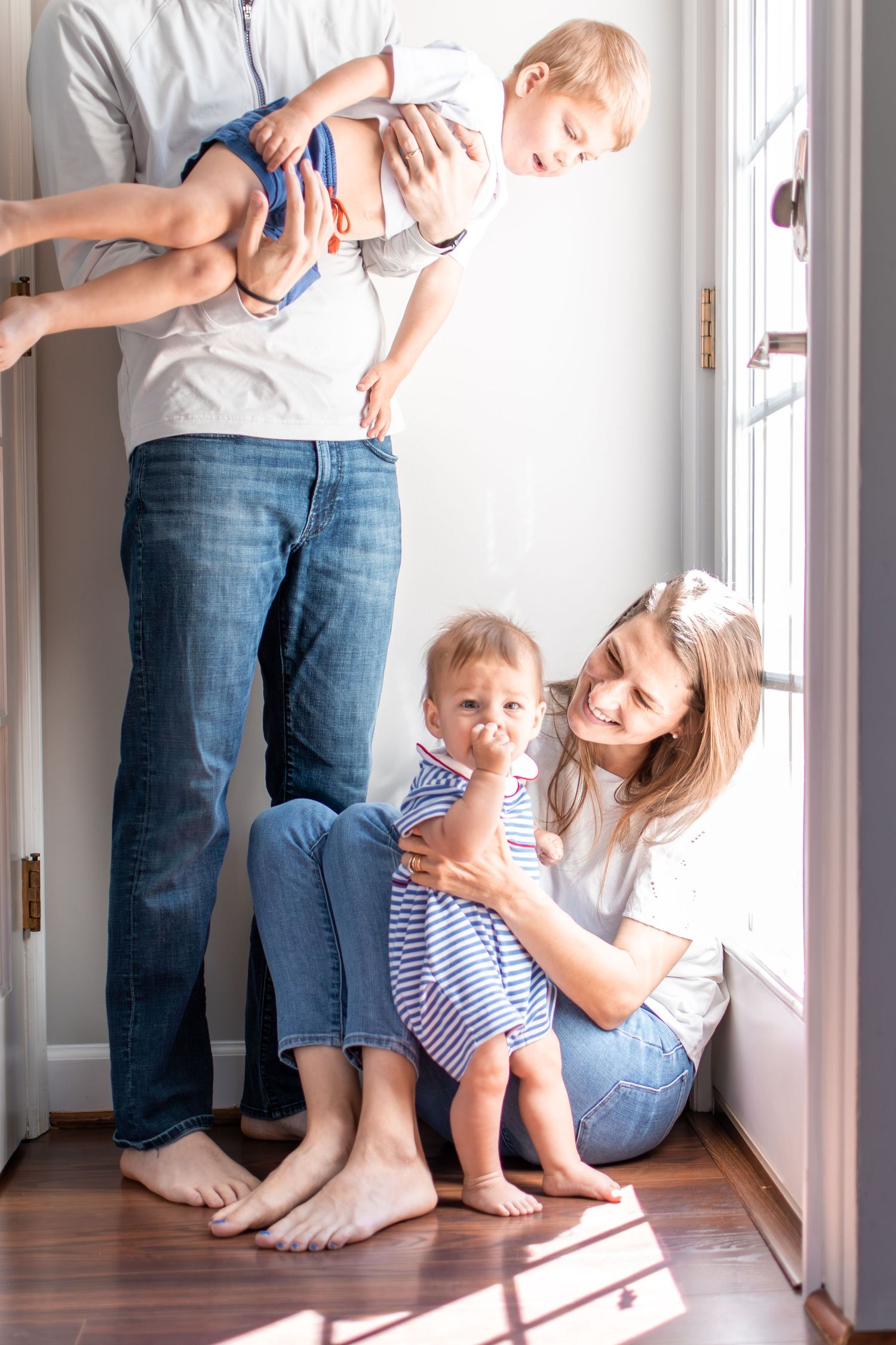 A Winston-Salem family plays together in a light-filled alcove in their home.