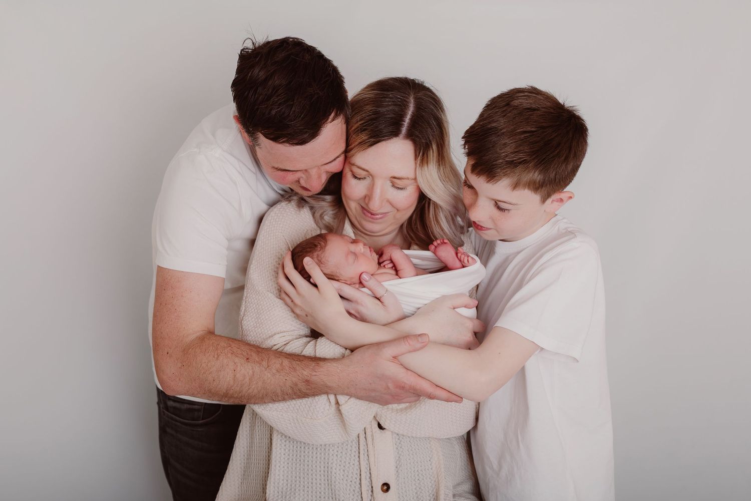 Intimate family portrait series in soft neutral tones against a light background. Photographer. Hull. East Yorkshire. Photography