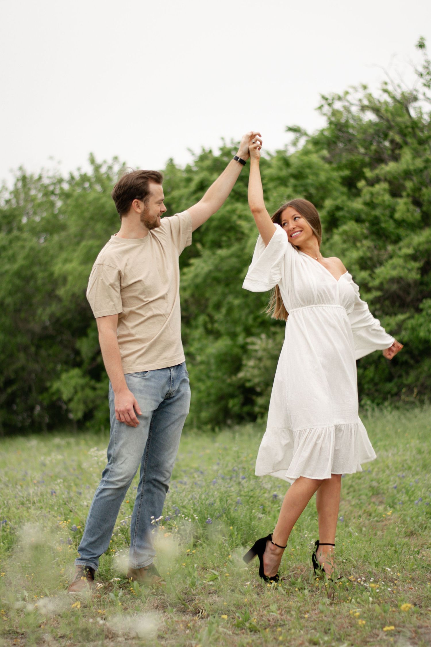 Couple dancing in a field of bluebonnets in Flower Mound, TX