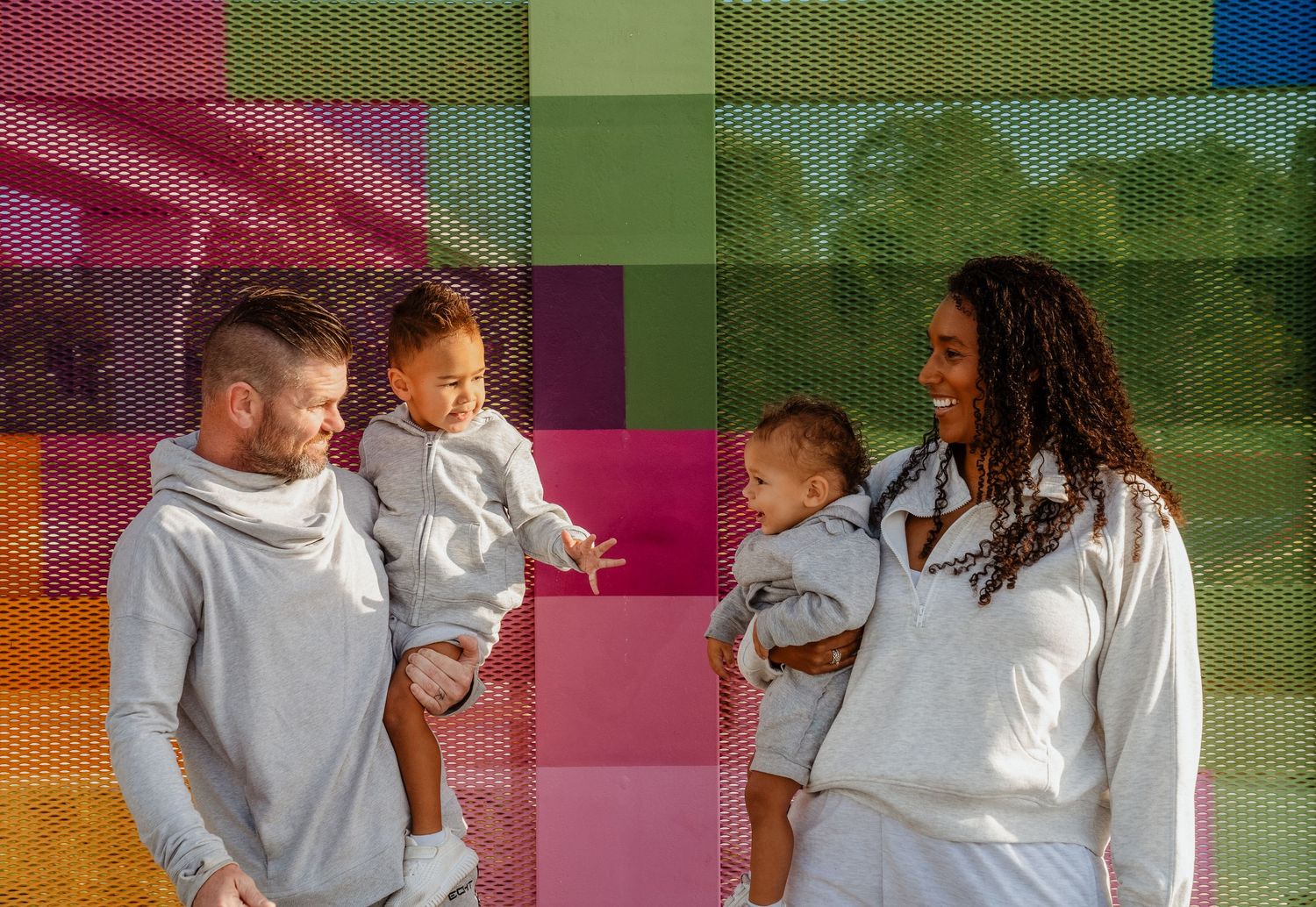 A family of four at a basketball court yard for a photo shoot in Sydney.